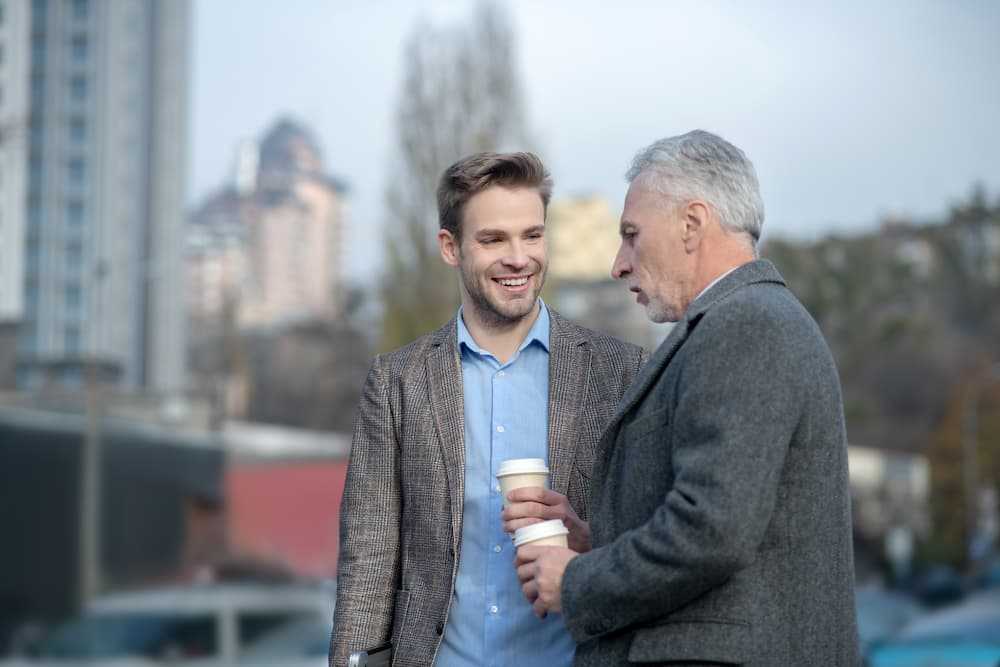 A young whitestone participant being mentored by an older gentleman.